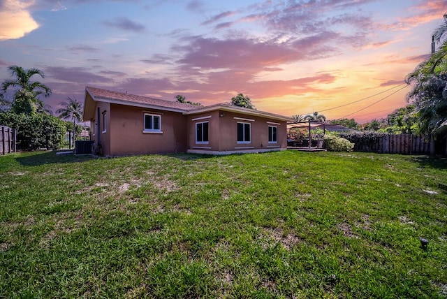 1950 N Conference Dr, Boca Raton, FL 33486 - back of house featuring stucco siding and central AC