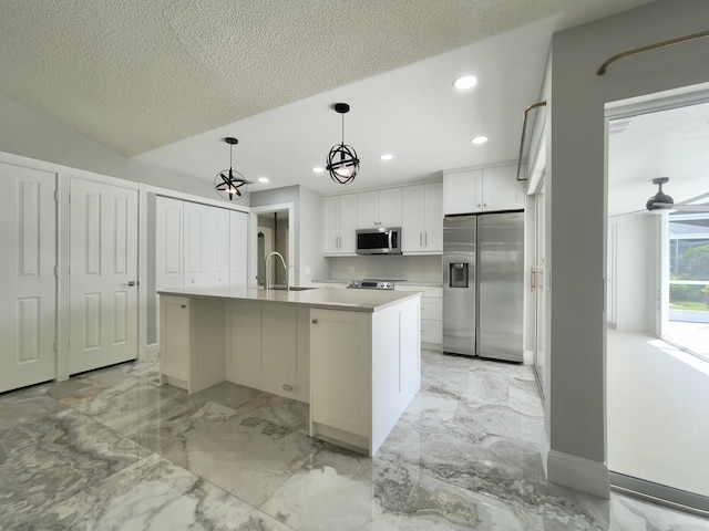 6503 Geminata Oak Ct, Palm Beach Gardens, FL 33410 - kitchen featuring stainless steel appliances, white cabinets, recessed lighting, light countertops, and light marble finish floors