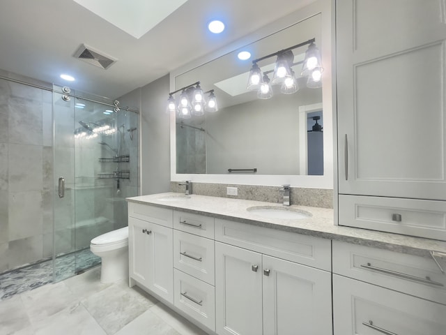 6503 Geminata Oak Ct, Palm Beach Gardens, FL 33410 - bathroom with double vanity, recessed lighting, a stall shower, and toilet