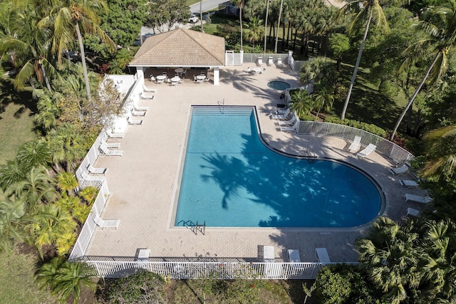 6503 Geminata Oak Ct, Palm Beach Gardens, FL 33410 - community pool featuring a patio area