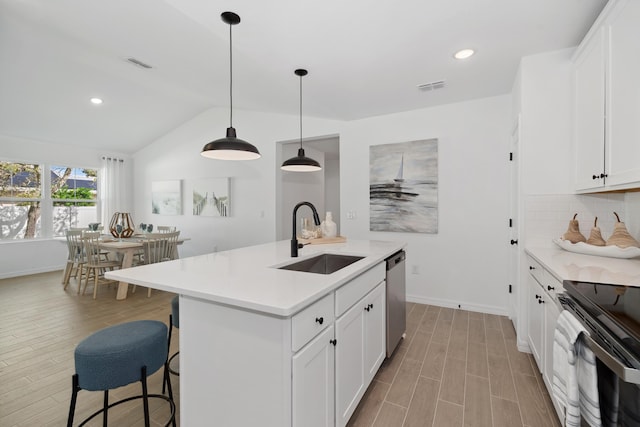 201 Ocarina St SW Unit 78, Palm Bay, FL 32908 - kitchen featuring a sink, stainless steel appliances, lofted ceiling, decorative backsplash, and baseboards