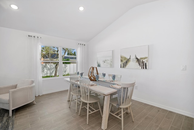 201 Ocarina St SW Unit 78, Palm Bay, FL 32908 - dining room featuring vaulted ceiling, baseboards, wood finished floors, and recessed lighting