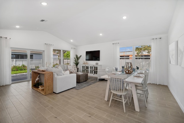 201 Ocarina St SW Unit 78, Palm Bay, FL 32908 - living room featuring lofted ceiling, healthy amount of natural light, light wood-type flooring, recessed lighting, and baseboards