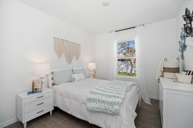 201 Ocarina St SW Unit 78, Palm Bay, FL 32908 - bedroom featuring baseboards and wood tiled floors