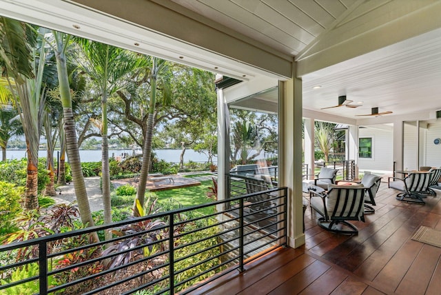 5488 Pennock Point Rd, Jupiter, FL 33458 - wooden terrace with a water view and a ceiling fan