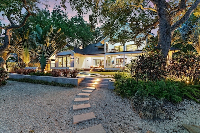 5488 Pennock Point Rd, Jupiter, FL 33458 - back of house featuring metal roof