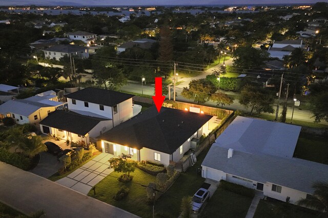 7802 Martin Ave, West Palm Beach, FL 33405 - pool at dusk featuring a fire pit, a fenced backyard, and a patio