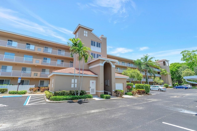 5746 Crystal Shores Dr Unit 206, Boynton Beach, FL 33437 - view of apartment building / complex featuring uncovered parking