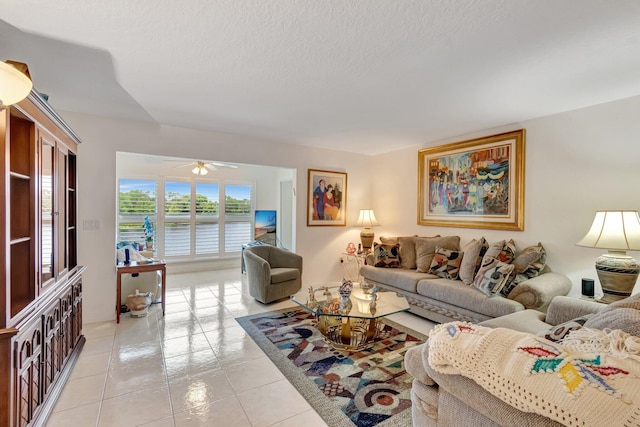5746 Crystal Shores Dr Unit 206, Boynton Beach, FL 33437 - living room with light tile patterned flooring, a ceiling fan, and a textured ceiling