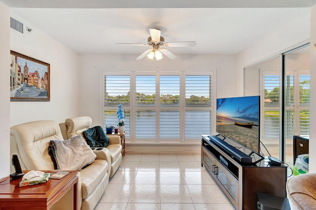 5746 Crystal Shores Dr Unit 206, Boynton Beach, FL 33437 - living room with a ceiling fan and light tile patterned floors