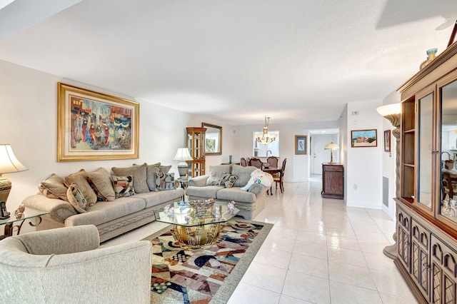5746 Crystal Shores Dr Unit 206, Boynton Beach, FL 33437 - living area featuring a chandelier, light tile patterned floors, and baseboards