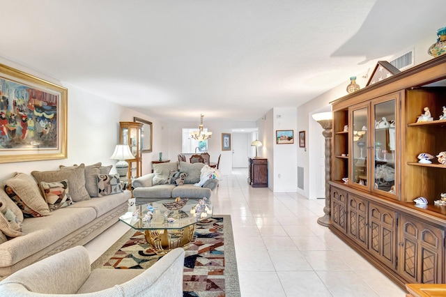 5746 Crystal Shores Dr Unit 206, Boynton Beach, FL 33437 - living area featuring a chandelier, light tile patterned flooring, and baseboards