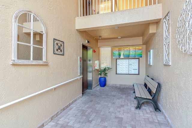 5746 Crystal Shores Dr Unit 206, Boynton Beach, FL 33437 - doorway to property featuring stucco siding and elevator