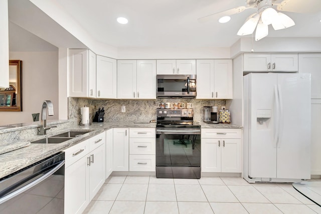 5746 Crystal Shores Dr Unit 206, Boynton Beach, FL 33437 - kitchen featuring stainless steel appliances, a sink, tasteful backsplash, light stone counters, and recessed lighting