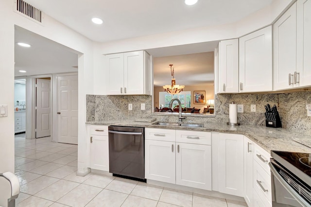 5746 Crystal Shores Dr Unit 206, Boynton Beach, FL 33437 - kitchen with stainless steel dishwasher, a sink, a chandelier, white cabinetry, and light tile patterned floors