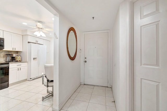 5746 Crystal Shores Dr Unit 206, Boynton Beach, FL 33437 - kitchen featuring appliances with stainless steel finishes, ceiling fan, tasteful backsplash, white cabinetry, and recessed lighting