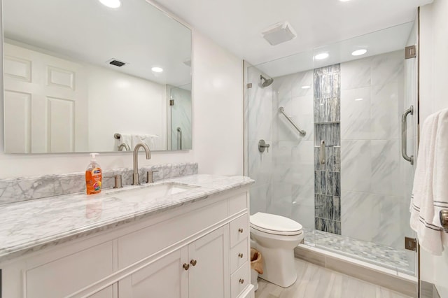 5746 Crystal Shores Dr Unit 206, Boynton Beach, FL 33437 - full bath featuring recessed lighting, toilet, vanity, a stall shower, and wood finished floors
