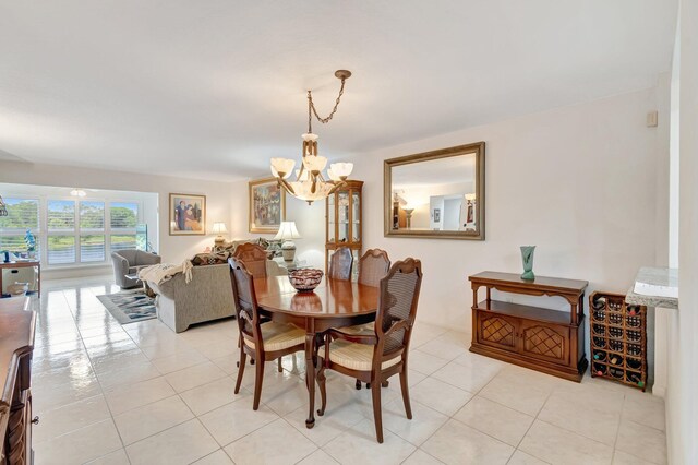 5746 Crystal Shores Dr Unit 206, Boynton Beach, FL 33437 - dining room featuring a chandelier and light tile patterned flooring