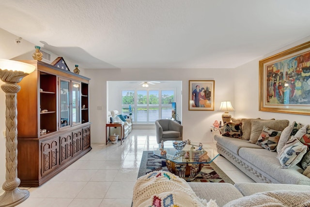 5746 Crystal Shores Dr Unit 206, Boynton Beach, FL 33437 - living room featuring light tile patterned floors, ceiling fan, and a textured ceiling