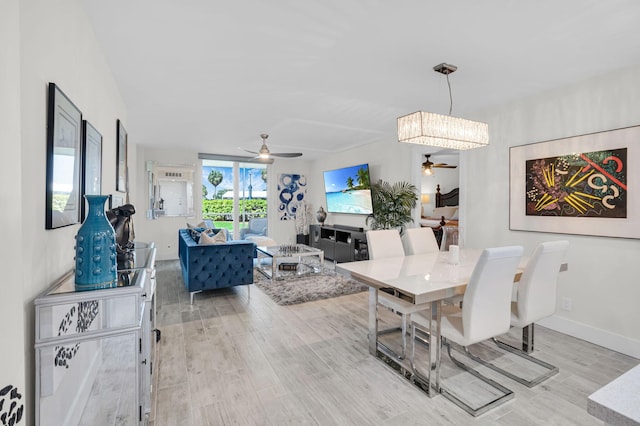 6699 NW 2nd Ave Unit 109, Boca Raton, FL 33487 - dining area featuring a ceiling fan and light wood-type flooring