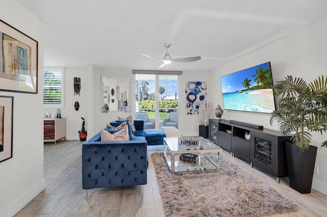 6699 NW 2nd Ave Unit 109, Boca Raton, FL 33487 - living room featuring wood finished floors, a ceiling fan, and baseboards