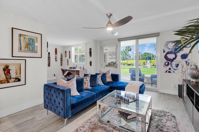 6699 NW 2nd Ave Unit 109, Boca Raton, FL 33487 - living area with light wood-style flooring, ceiling fan, and baseboards