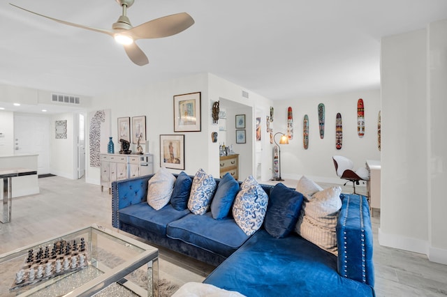 6699 NW 2nd Ave Unit 109, Boca Raton, FL 33487 - living room featuring light wood-style flooring, a ceiling fan, and baseboards