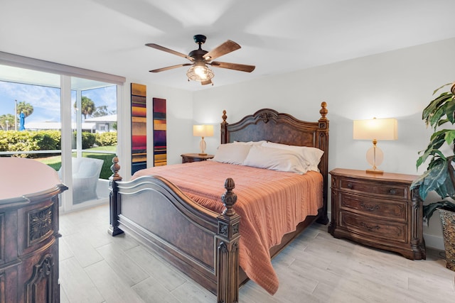 6699 NW 2nd Ave Unit 109, Boca Raton, FL 33487 - bedroom with access to exterior, light wood finished floors, and a ceiling fan