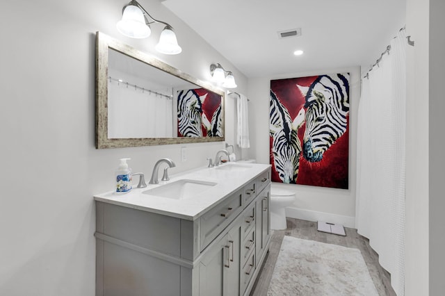 6699 NW 2nd Ave Unit 109, Boca Raton, FL 33487 - full bath featuring double vanity, toilet, recessed lighting, and baseboards