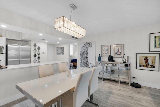 6699 NW 2nd Ave Unit 109, Boca Raton, FL 33487 - dining room featuring light wood-style flooring, a chandelier, baseboards, and recessed lighting