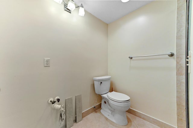 7 Normandy Unit A, Delray Beach, FL 33484 - bathroom with toilet, baseboards, and tile patterned flooring