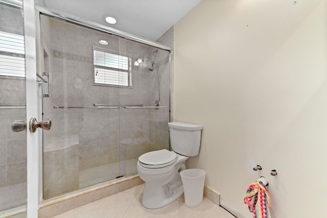 7 Normandy Unit A, Delray Beach, FL 33484 - full bathroom with toilet, tile patterned flooring, a shower stall, and baseboards