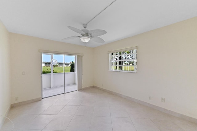 7 Normandy Unit A, Delray Beach, FL 33484 - unfurnished room featuring ceiling fan, light tile patterned floors, and baseboards