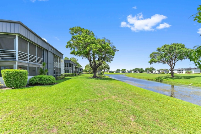 7 Normandy Unit A, Delray Beach, FL 33484 - view of green lawn with a water view
