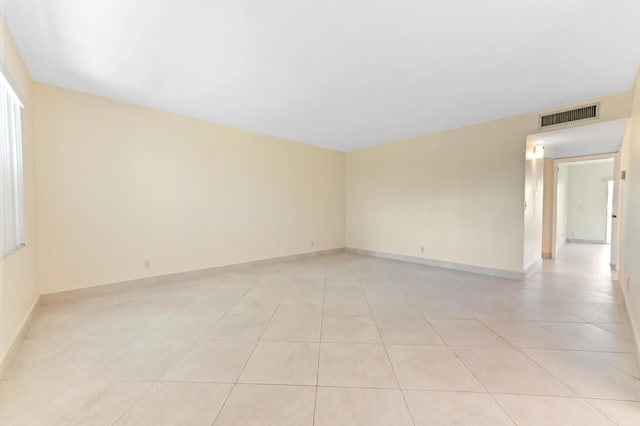 7 Normandy Unit A, Delray Beach, FL 33484 - unfurnished room with light tile patterned floors and baseboards