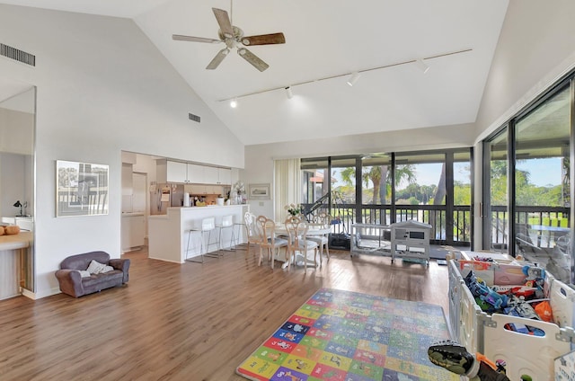 19411 Sabal Lake Dr Unit 5018, Boca Raton, FL 33434 - living room with rail lighting, high vaulted ceiling, wood finished floors, and a ceiling fan