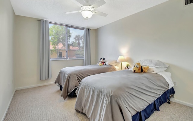 700 Scotia Dr Unit 202, Hypoluxo, FL 33462 - bedroom with light colored carpet, baseboards, and ceiling fan