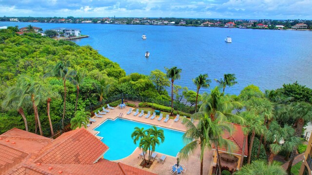 700 Scotia Dr Unit 202, Hypoluxo, FL 33462 - community pool with a water view and a patio