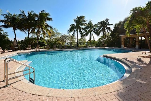 700 Scotia Dr Unit 202, Hypoluxo, FL 33462 - community pool with a patio area