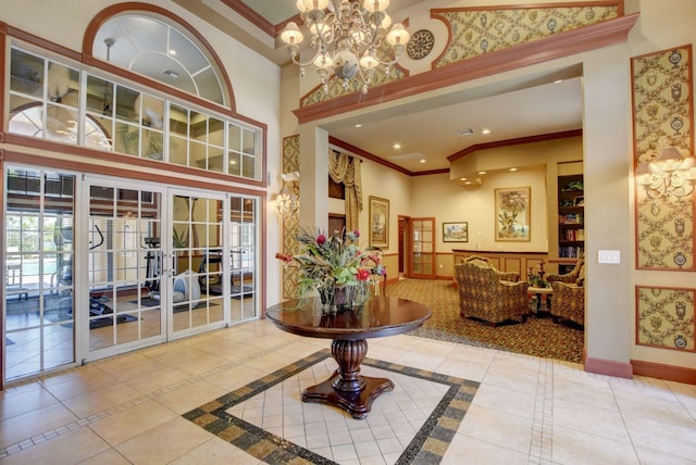 700 Scotia Dr Unit 202, Hypoluxo, FL 33462 - tiled foyer featuring crown molding, a high ceiling, french doors, a chandelier, and recessed lighting