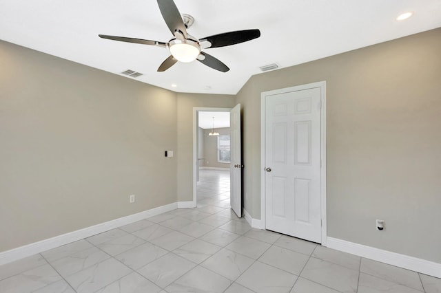 1897 SW Lofgren Ave, Port Saint Lucie, FL 34953 - empty room featuring ceiling fan, baseboards, recessed lighting, and light marble finish flooring