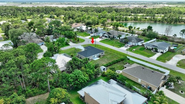 1897 SW Lofgren Ave, Port Saint Lucie, FL 34953 - aerial view of residential area featuring a nearby body of water