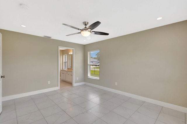 1897 SW Lofgren Ave, Port Saint Lucie, FL 34953 - spare room featuring light marble finish flooring, ceiling fan, baseboards, and recessed lighting
