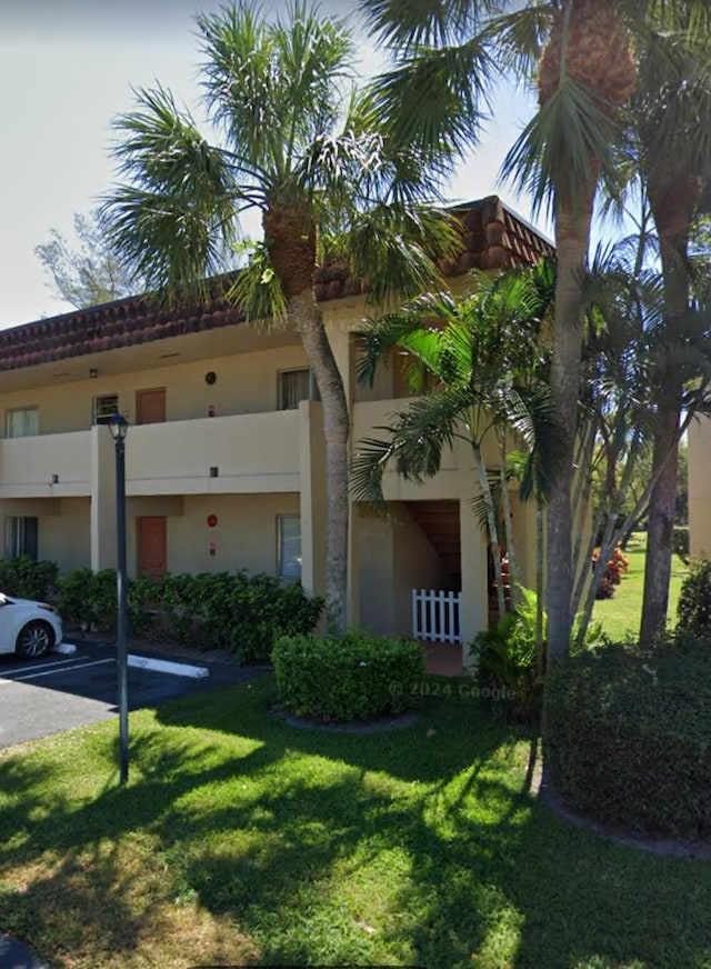 829 Camino Rd Unit 206-C, Delray Beach, FL 33445 - view of property with uncovered parking