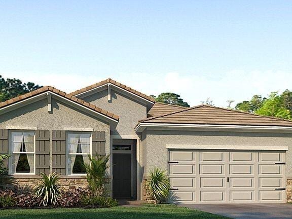 10552 SW Toren Way, Port Saint Lucie, FL 34987 - view of front of home with an attached garage, concrete driveway, a tile roof, stucco siding, and stone siding
