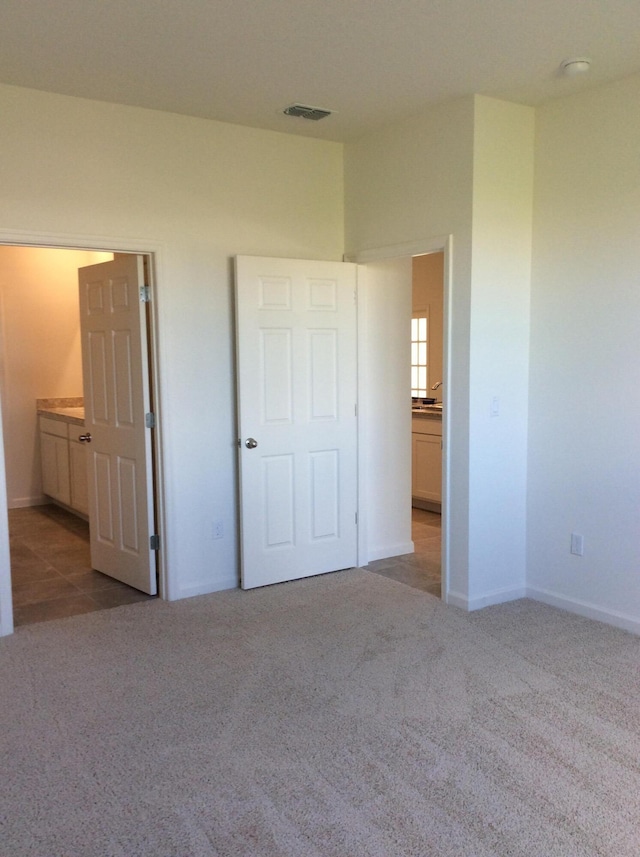 10552 SW Toren Way, Port Saint Lucie, FL 34987 - unfurnished bedroom with carpet floors and baseboards