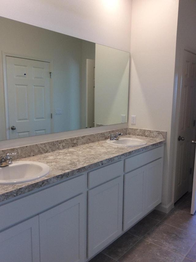 10552 SW Toren Way, Port Saint Lucie, FL 34987 - full bathroom featuring double vanity and tile patterned flooring