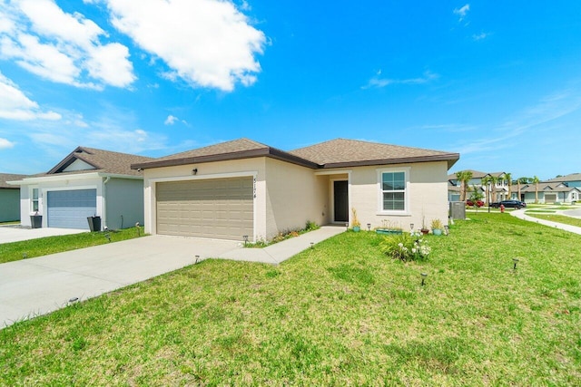 5174 Armina Pl, Fort Pierce, FL 34951 - view of front of home with a garage, stucco siding, and driveway
