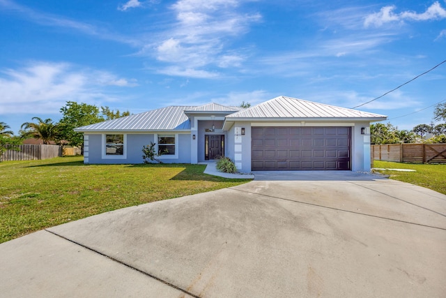 5647 NW Lorna Ct, Port Saint Lucie, FL 34986 - ranch-style home featuring stucco siding, concrete driveway, a metal roof, and an attached garage