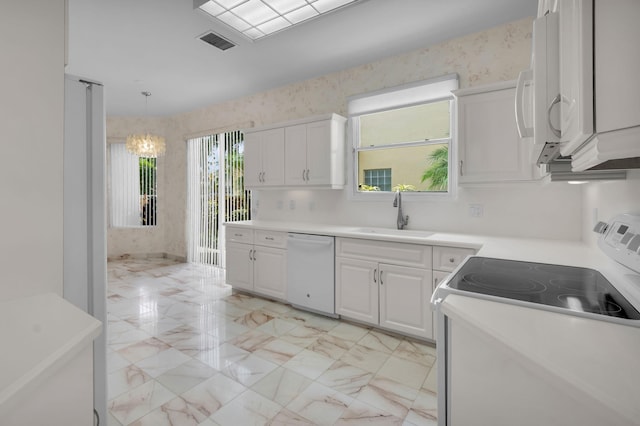 7729 Travlers Tree Dr, Boca Raton, FL 33433 - kitchen with white appliances, a sink, white cabinetry, light marble finish flooring, and light countertops